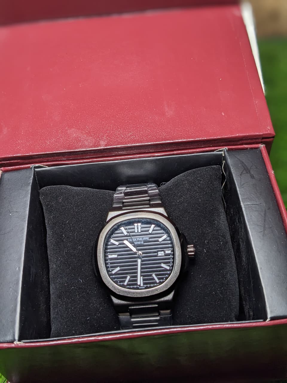 Watch in a red box with a black interior