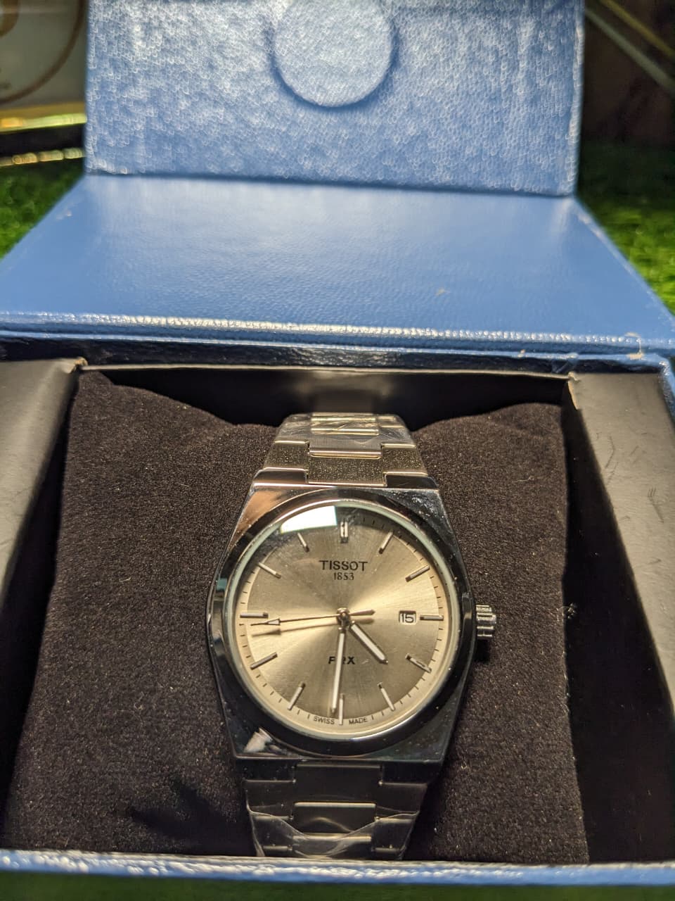 Tissot watch in a blue box with a brown interior.mens wach