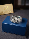 Silver watch on a blue box with 'AJ Premium' branding in the background